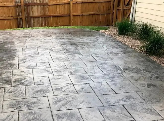 Slate-pattern stamped concrete basement patio with textured finish and color variation